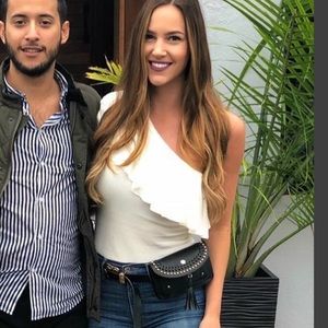 One shoulder, one sleeve white ruffle bodysuit